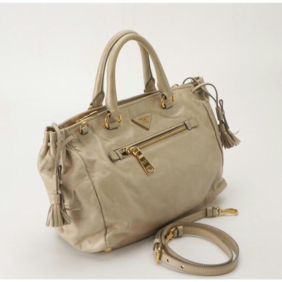 Authenticated Prada Vitello Daino Drawstring Leather Tote - Picture 4 of 10